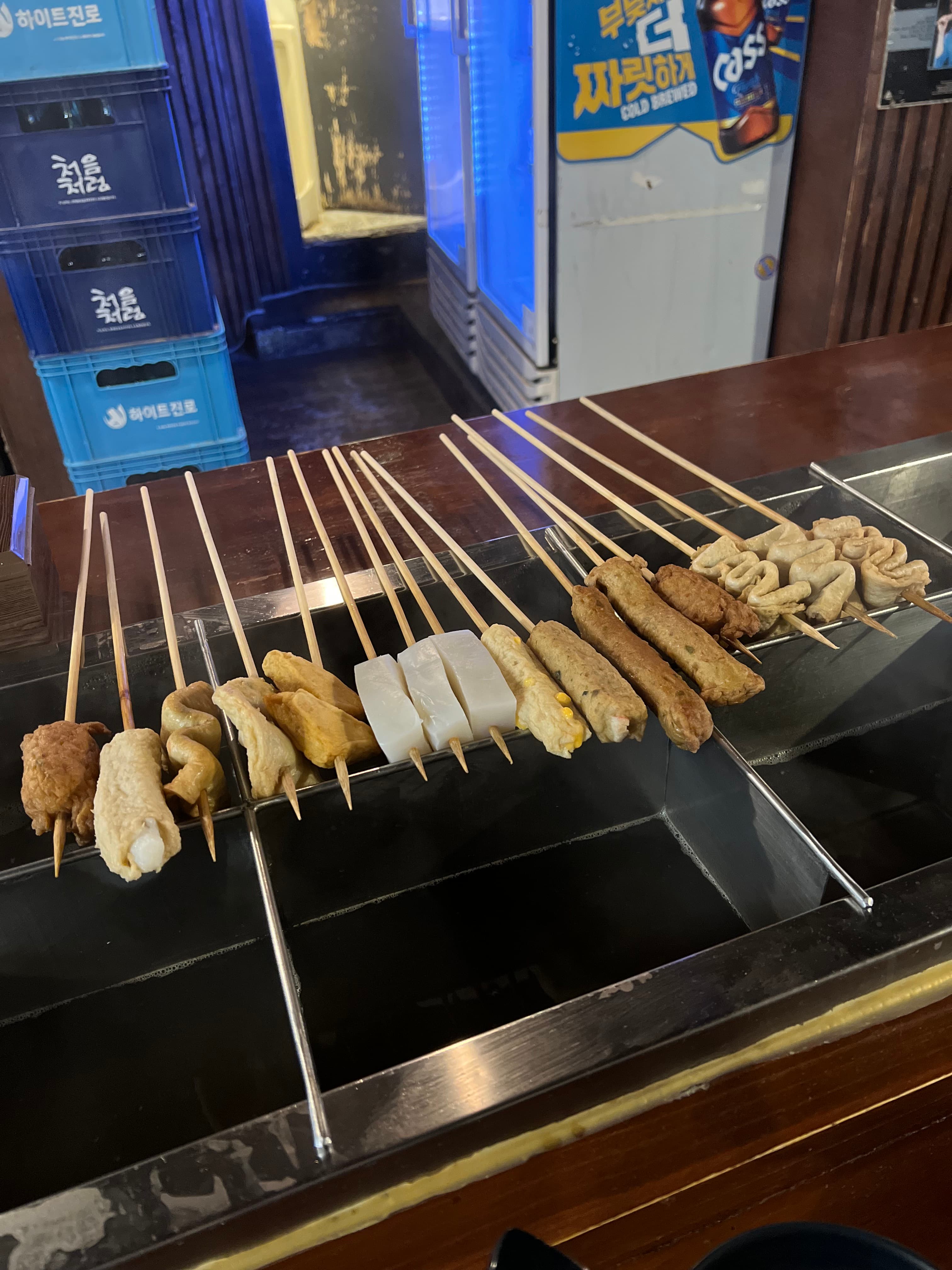 Assorted eomuk fish-cake skewers arranged at a Seoul street-food counter