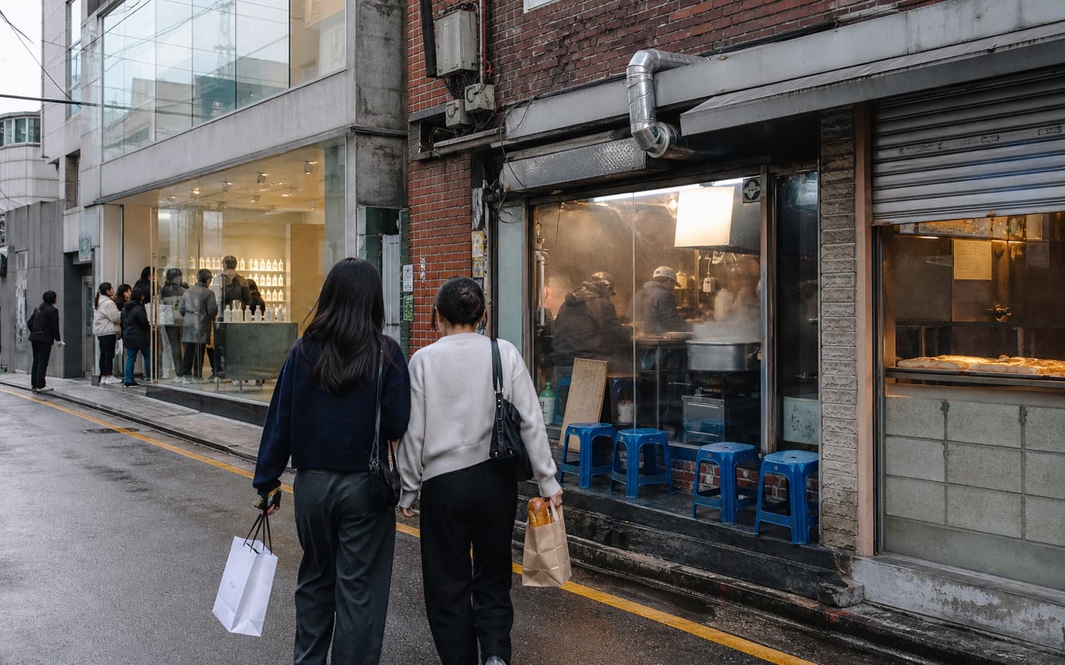 A Seongsu street where a modern glass flagship meets older brick shops and local eateries